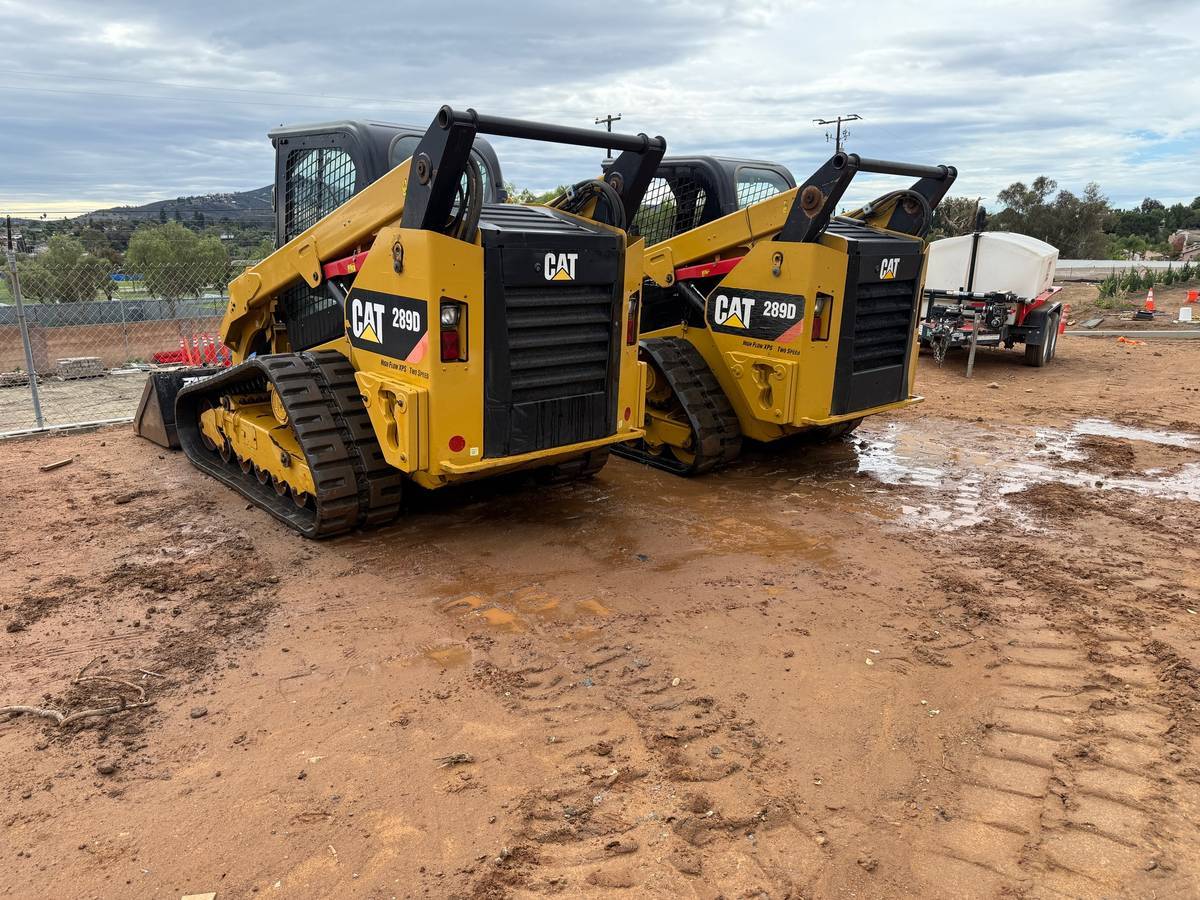 Two CAT 289D track loaders on the job site